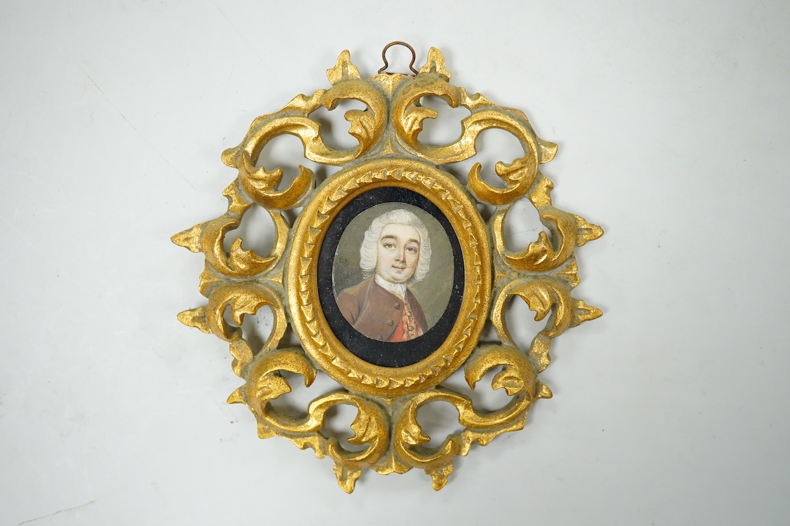 Mid 18th century School, Portrait miniature of a gentleman wearing a frock coat and wig, on ivory, housed in a modern Florentine style gilt frame, overall 13cm high, CITES Submission reference L32N1DB6